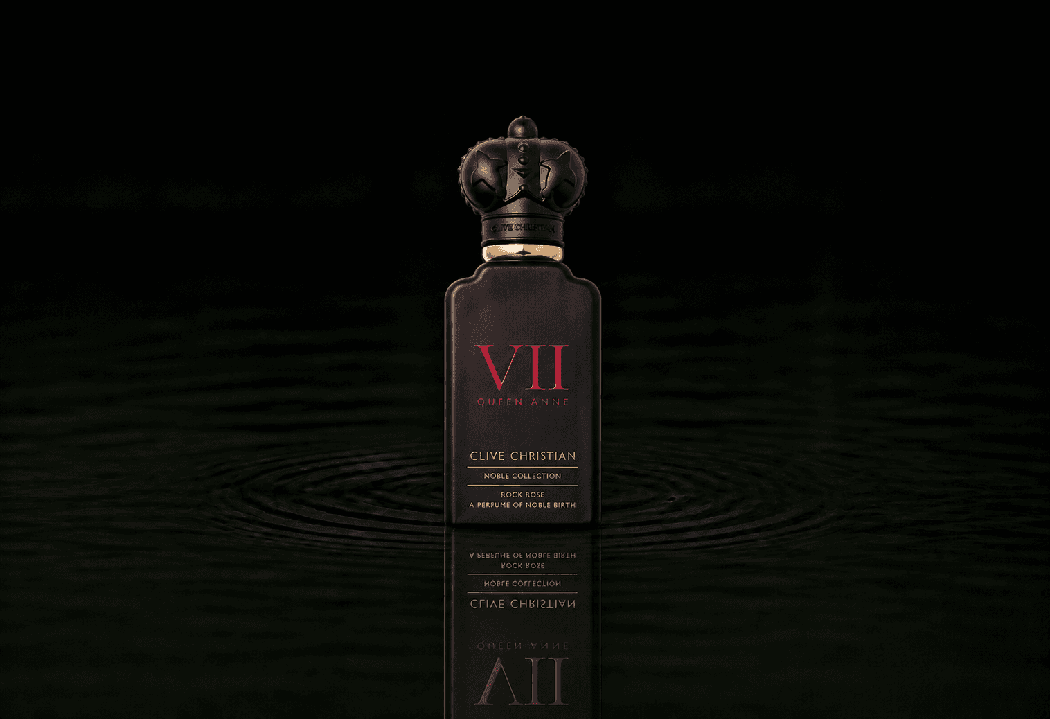 Clive Christian Noble VII - Rock Rose fragrance bottle floating above dark water