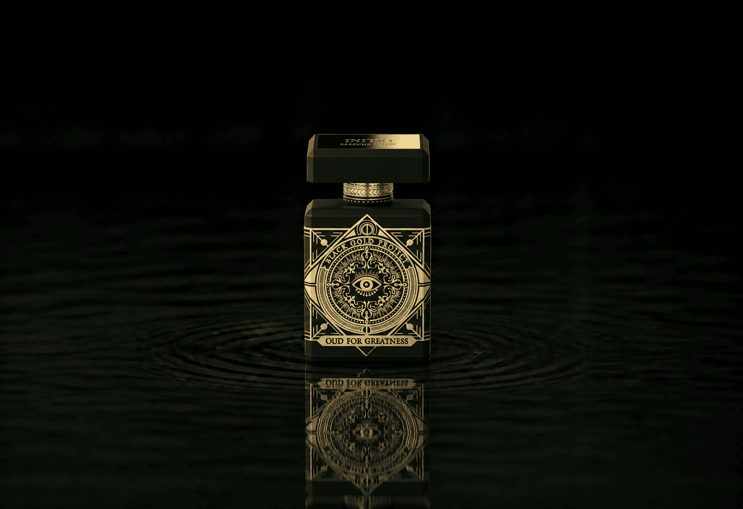 Initio Oud For Greatness fragrance bottle floating above dark water